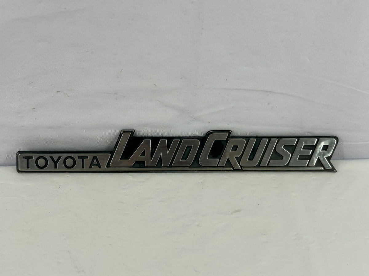84-90 Toyota Land Cruiser FJ62 Rear Left Quarter Panel Emblem OEM 75370-90A02
