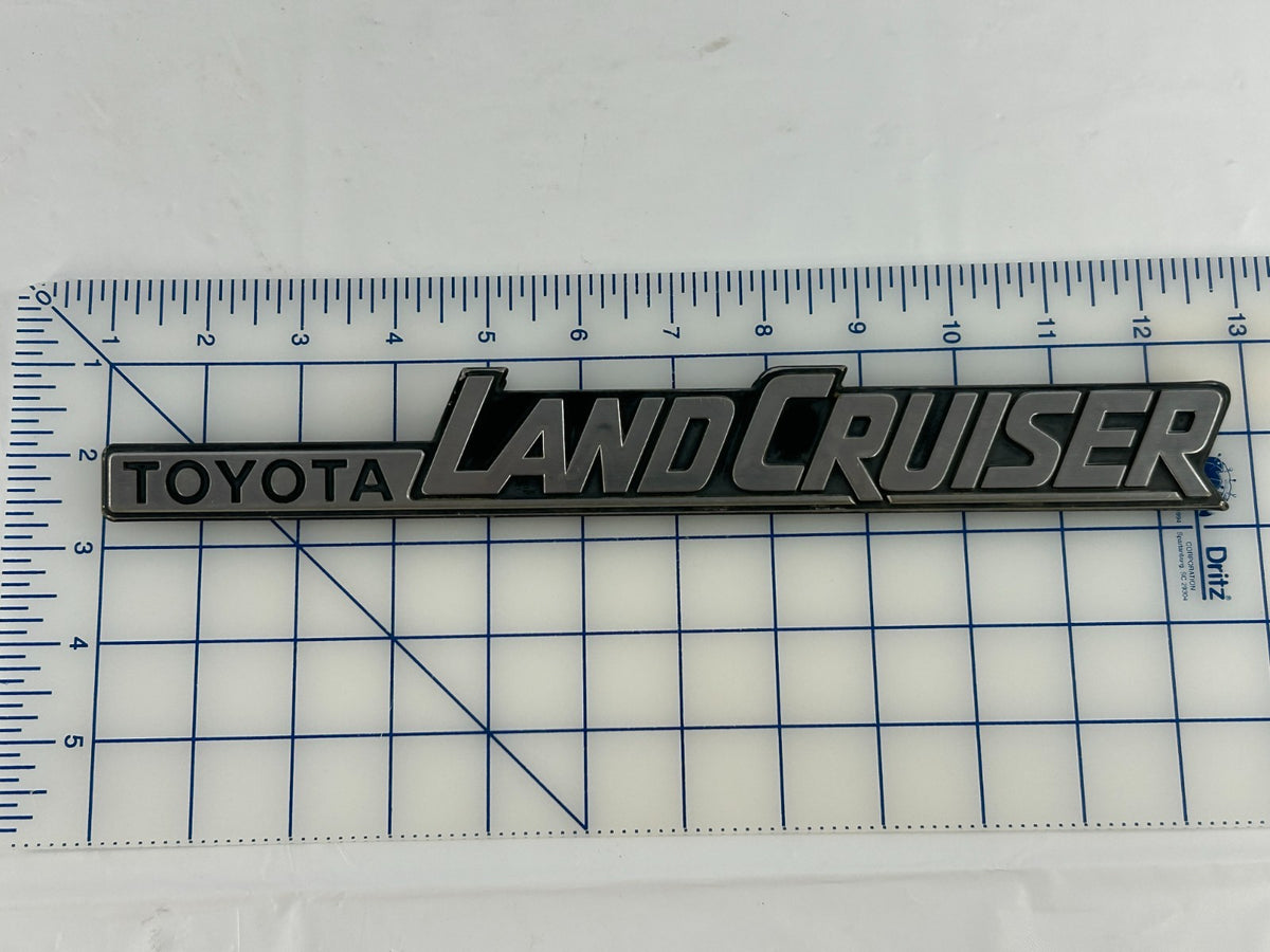 84-90 Toyota Land Cruiser FJ62 Rear Left Quarter Panel Emblem OEM 75370-90A02